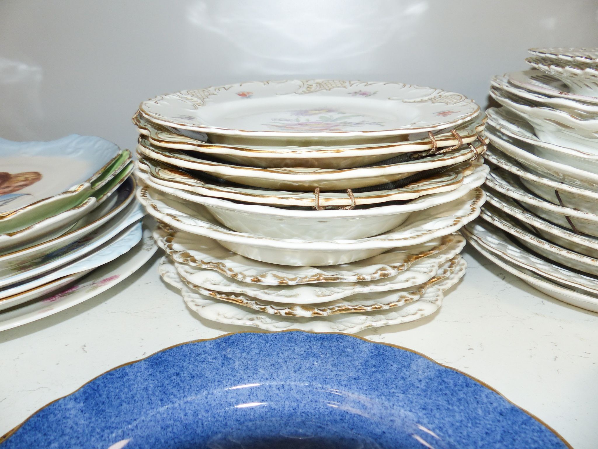 A collection of 19th/20th century Continental porcelain wall plates including a Royal Worcester powder blue fruit painted plate signed W. Bee, 23cm